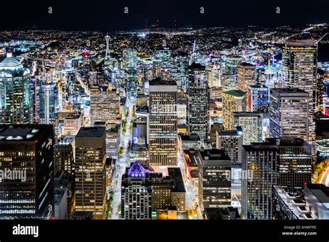 Aerial View Of Seattle Downtown Skyline At Night With Modern