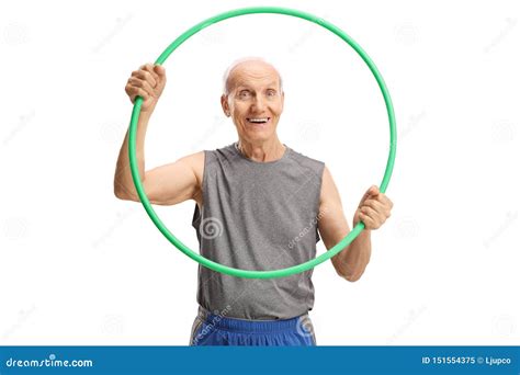 Smiling Elderly Man Holding A Hula Hoop And Looking At The Camera Stock