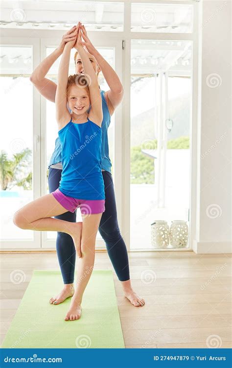 Its Fun And Good For The Body A Mother And Daughter Doing Yoga