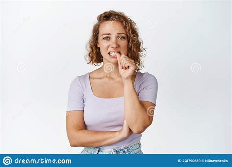 Nervous Blond Girl Biting Finger And Looking Insecure Scared Of