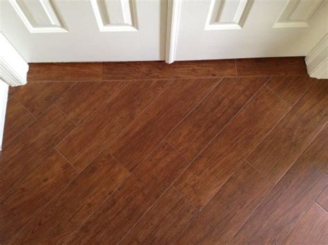 It can handle your clumsy spouse, take on your temperamental toddler, and stand up to your feisty fur babies. Porcelain plank wood look tile installations Tampa, Florida - Contemporary - Entry - tampa - by ...