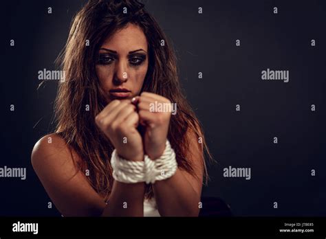 Desperate Kidnaped Woman Tied With Rope In Dark Waiting For Help Stock Photo Alamy