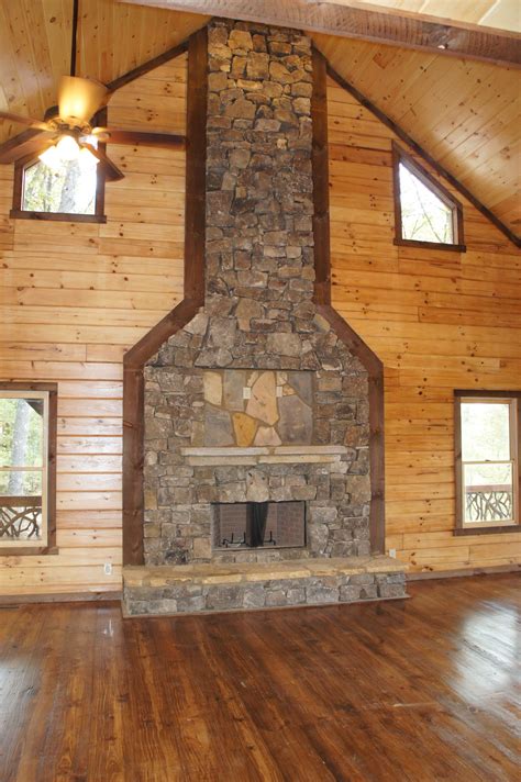 massive heavy fieldstone fireplace main focal point of living area stacked stone fireplaces
