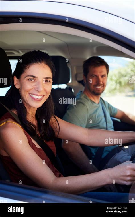 Mid Adult White Woman Driving Car Husband In Front Passenger Seat