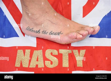 Veteran Toe Wrestling Champion Alan Nasty Nash Displays A Tattoo At The World Toe Wrestling