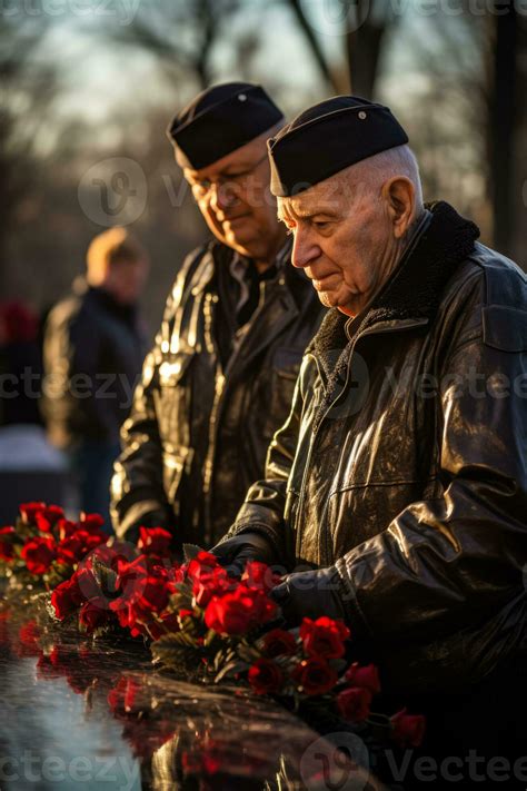 Reflective Veterans Reminisce Beside War Monuments On A Solemn Veterans Day Stock Photo