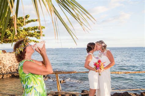 First Kiss At Lesbian Wedding In Maui Two Brides With Tropical Hawaiian Flower Bouquets At