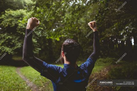 Excited Athlete Clenching His Fists In Forest — Runner Man Stock