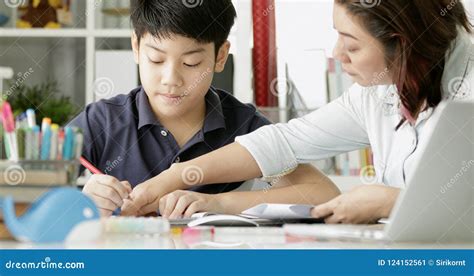 Cute Asian Mother Helping Your Son Doing Your Homework Stock Image Image Of Book Notebook