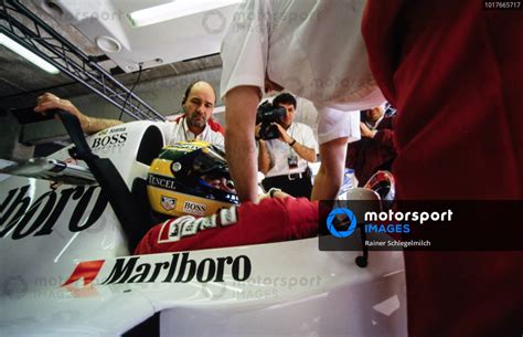 Ayrton Senna Is Helped Into His Mclaren Mp4 8 Ford By Mechanics
