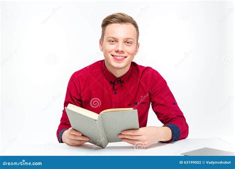 Happy Smiling Handsome Man Sitting And Reading Book Stock Photo Image