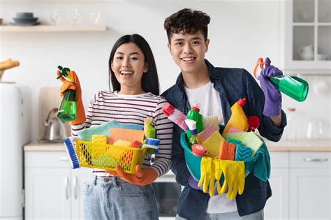 Positive Young Korean Man And Woman With Cleaning Supplies Stock Image Image Of Chinese Tidy