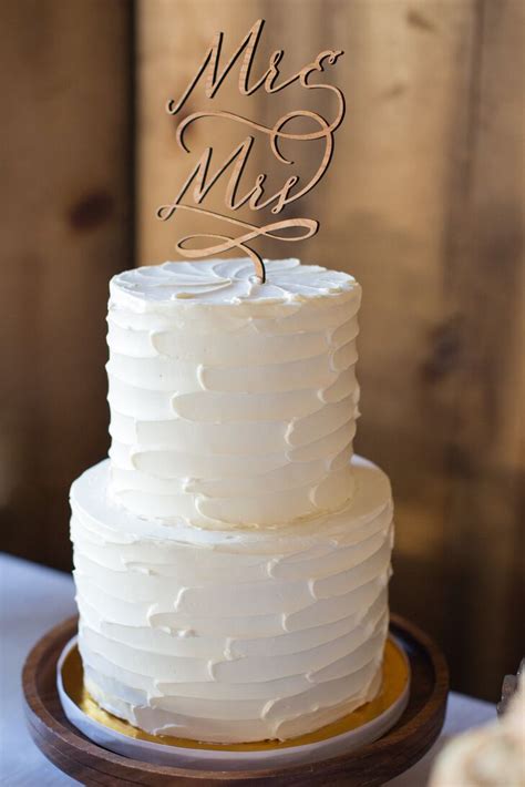 White Wedding Cake With Wooden Topper