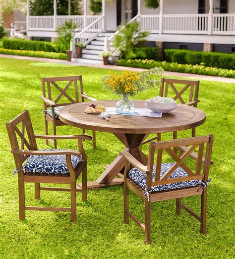 The most common round garden table material is cotton. Claremont Eucalyptus Round Dining Table and Chairs ...