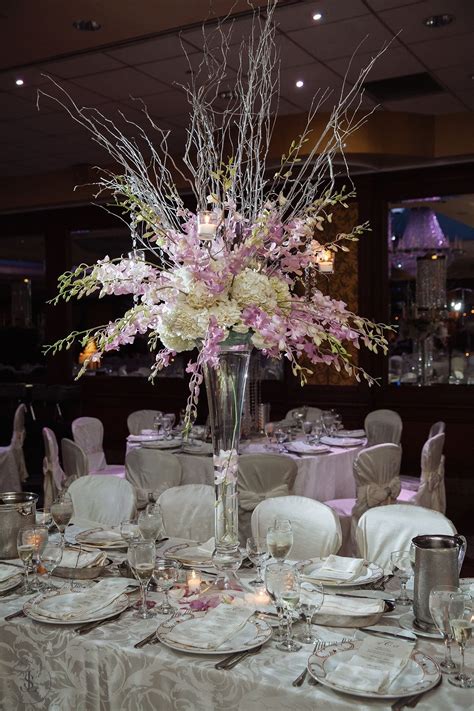 Beautiful Centerpiece With Silver Branches With Blush Dendrobium