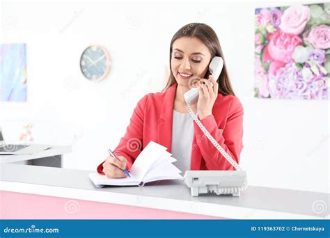 Beauty Salon Receptionist Talking on Phone Stock Photo - Image of