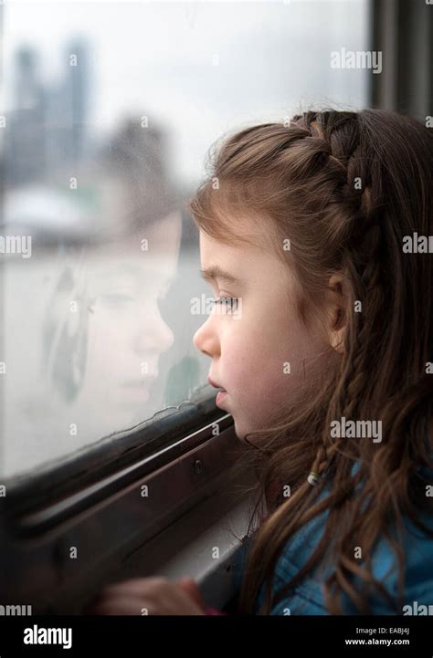 Girl Looking Out Window Stock Photo Alamy