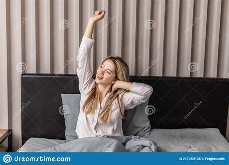 Beautiful Young Woman Wakes Up And Stretches On The Pillow Stock Image