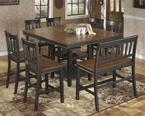 The rectangle dining table features a trestle style base, perfecting the rustic, farmhouse style. Ashley Furniture Owingsville 8 Piece Counter Dining Set ...