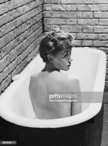 Portrait Of Actress Glynis Johns Taking A Bath In A Prison Cell In A