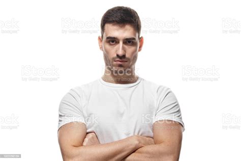 Tough Guy Standing With Crossed Arms Isolated On White Background