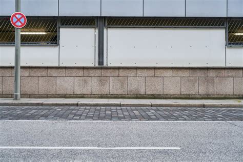 Empty Street And Sidewalk In Front Of A Wall Stock Photo Image Of