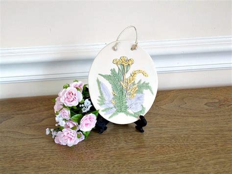 Flower wall hanging, ceramic wildflower, camelia, and daisy wall sculptures, flower art, ceramic blooms, floral sculpture, floral mural. Ceramic Wall Hanging Flowers Wildflowers Oval Wall Hanging