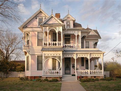 Pink Victorian Home Exterior With Ornate White Molding Hgtv
