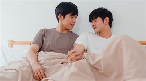 Free Photo Handsome Asian Gay Couple Talking On Bed At Home Young