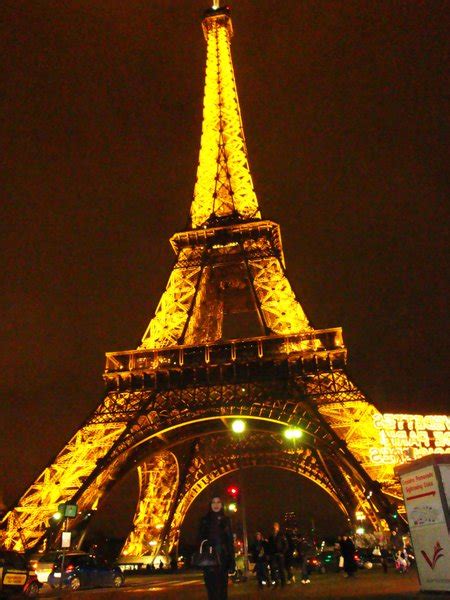 Eiffel Tower Lights Up At Night Photo