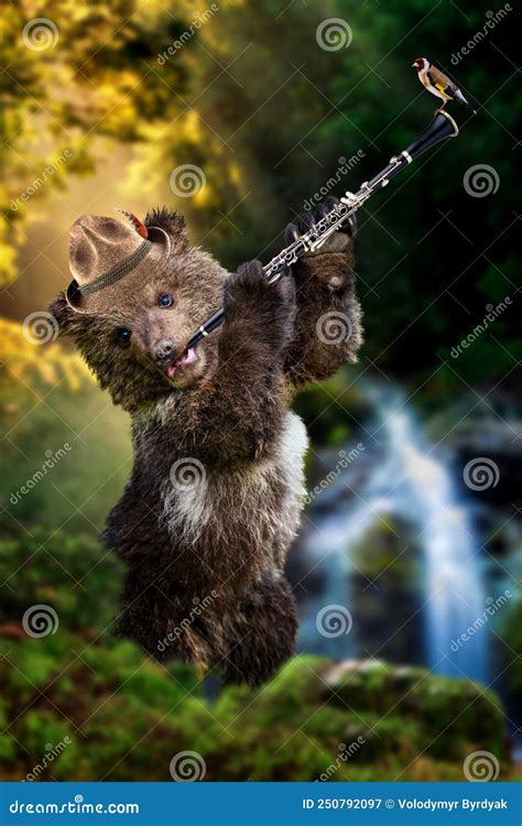 Bear Cub Plays A Wind Instrument In The Middle Of The Forest In A Hat