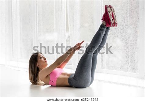 Sexy Fitness Athlete Performs Exercises On The Muscles Of The Press In