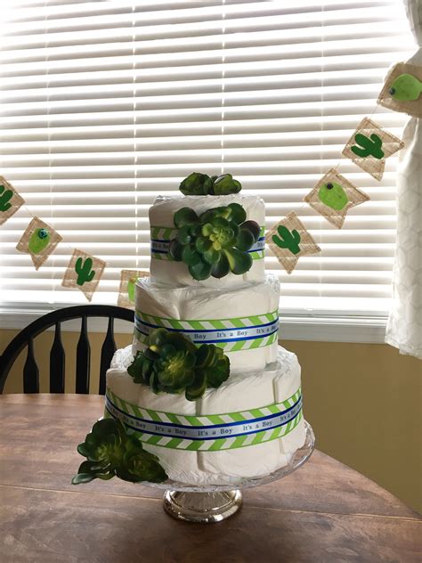 Diaper cake for Jessica's party I made and the cactus banner behind it