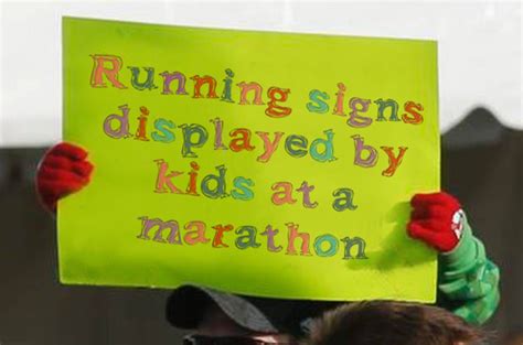 Running Signs Displayed By Kids At A Marathon