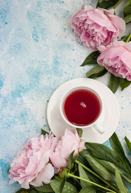 Premium Photo Cup Of Tea And Pink Peonies Flowers