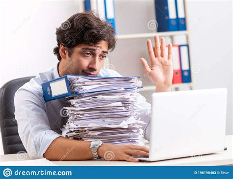 Overloaded Busy Employee With Too Much Work And Paperwork Stock Image