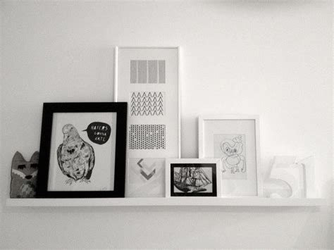 Ikea Ribba picture rail with various white and black frames and mounts ...