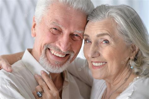 Premium Photo Portrait Of A Happy Senior Couple Hugging At Home