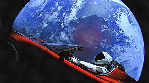 Starman in Tesla with planet earth Photograph by SpaceX