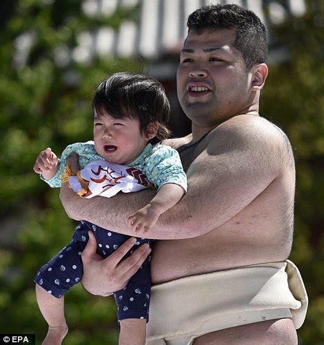Japanese Sumo Wrestlers Make Babies Cry During Ancient Festival Daily