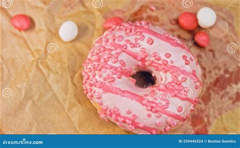 Pink Donuts Decorated With Pink Icing Donuts Are On A Piece Of Paper
