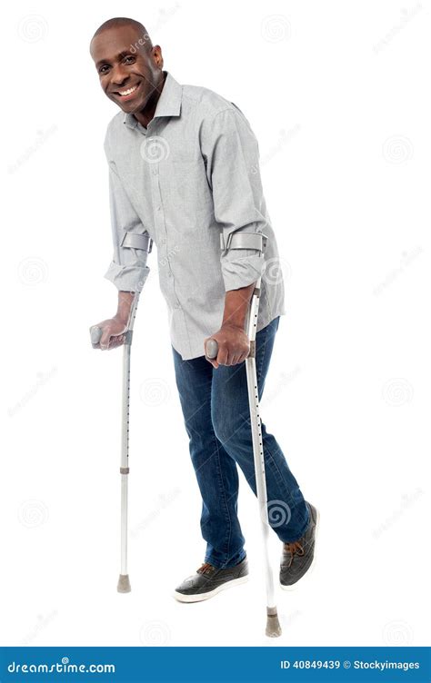 Man Walking With Crutches Isolated On A White Stock Image Image Of