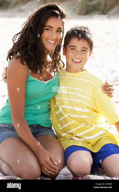 Portrait Teenage Brother And Sister On Beach Stock Photo Alamy