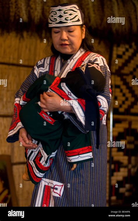 An Ainu Woman Performs A Traditional Lullaby Song At The Poroto Kotan