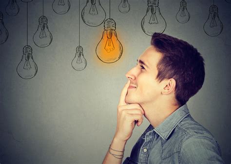 Thinking Man Looking Up With Light Idea Bulb Above Head Isolated On
