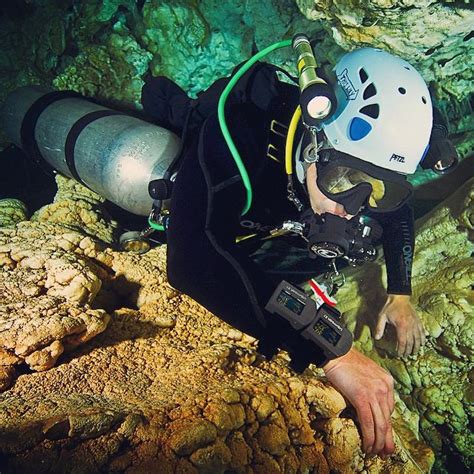 A Brave Diver Squeezes Through The Cracks While Cave Diving With His X1