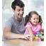 Happy Father And Daughter Playing With Building Blocks At Table In 