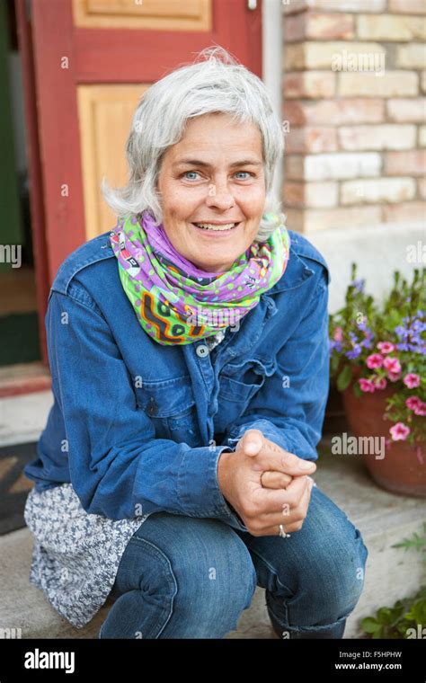 Sweden Skane Hoganas Portrait Of Mature Woman In Back Yard Stock