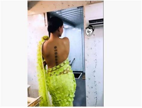 Wearing Net Saree Without A Blouse This Actress Hides The