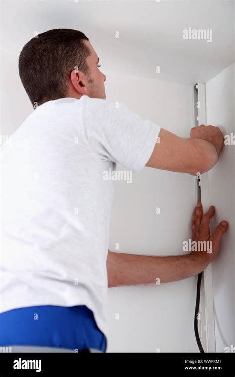 Man Covering An Electrical Wire Stock Photo Alamy